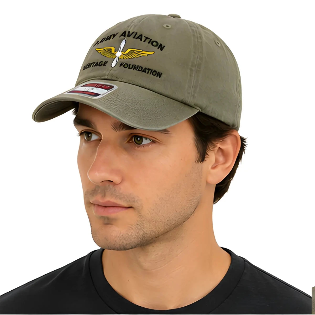Green Army Aviation Heritage Foundation Dad Hat - SearchPify - Man wearing a green cap with embroidered text and logo on a white background