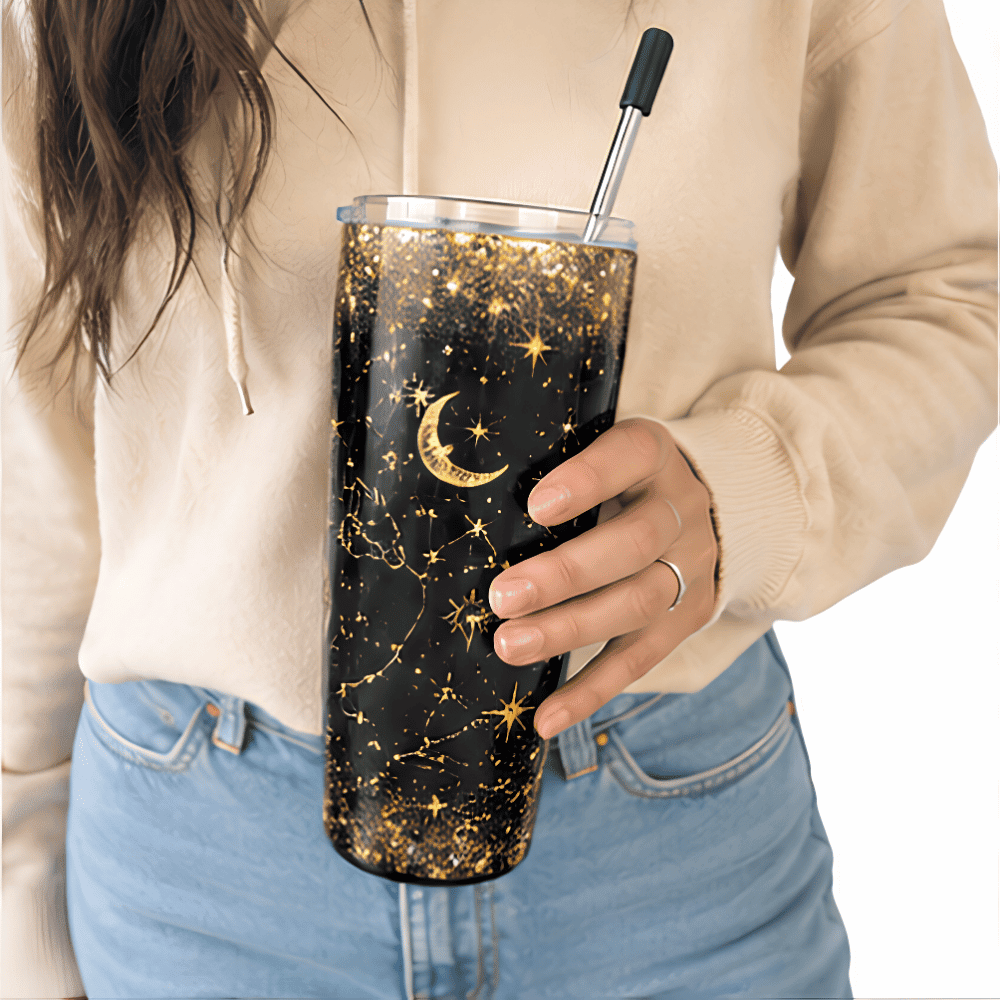 20 oz Constellation Tumbler - SearchPify - Elizabeth’s Jewelry & Creations Person holding a tumbler with star and moon design