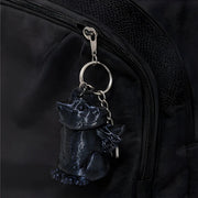 3D-Printed Dragon Keychain Storage Container - SearchPify - Black cat-shaped keychain attached to a black backpack