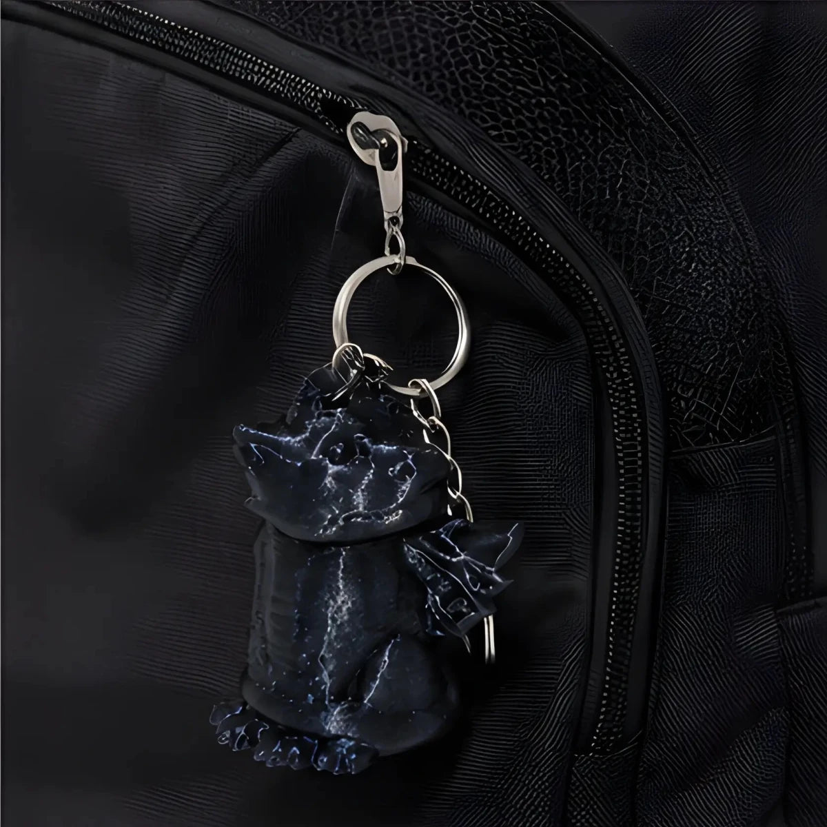 3D-Printed Dragon Keychain Storage Container - SearchPify - Black cat-shaped keychain attached to a black backpack
