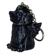 3D-Printed Dragon Keychain Storage Container - SearchPify - Black angel and demon keychain on a white background