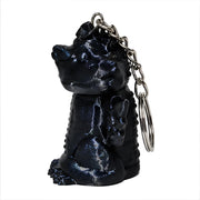 3D-Printed Dragon Keychain Storage Container - SearchPify - Black dragon-shaped keychain with a metallic ring on a white background