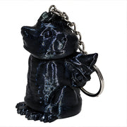 Black angel and demon keychain on a white background