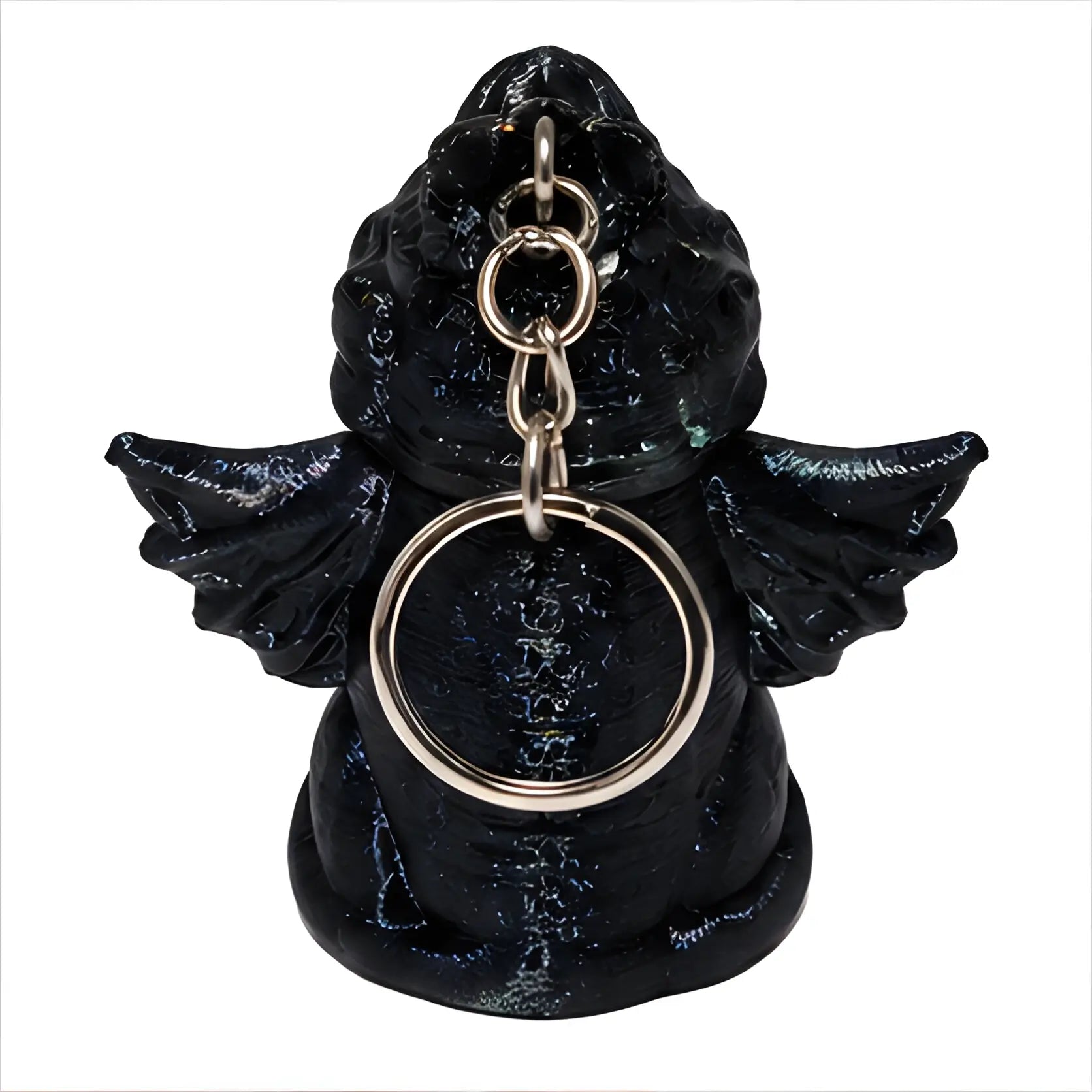Black angel figurine with wings holding a silver ring on a white background
