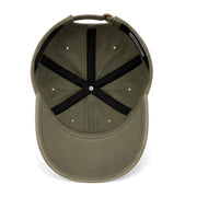 Green cap with black X on a white background