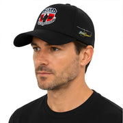 Man wearing a black cap with a logo on a white background