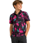 Child wearing a colorful patterned shirt with flamingos and leaves on a white background