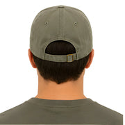 Person wearing a green cap and shirt on a white background